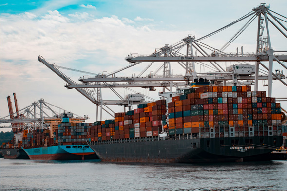 Container ship and cranes at a dock