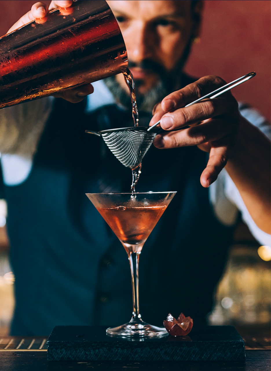 Barman mixing a cocktail