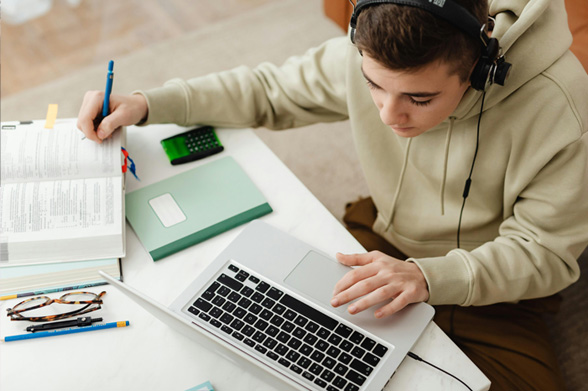 Student studying using a laptop